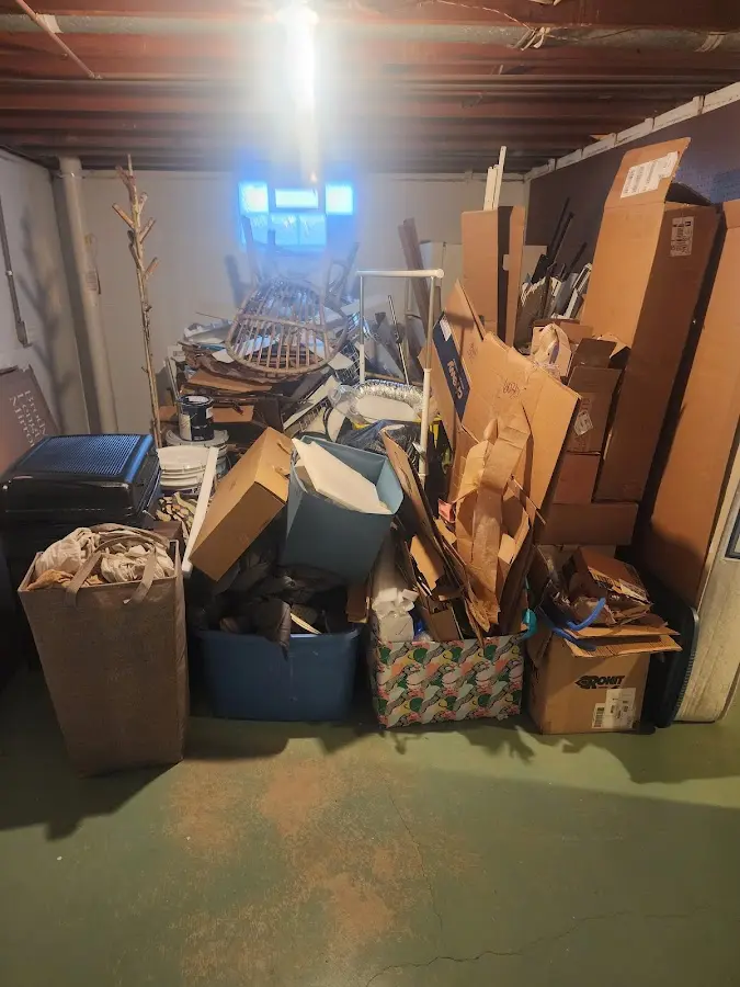 Roll-off dumpster container at job site for 2 Yard Dumpster Rental in Seven Oaks