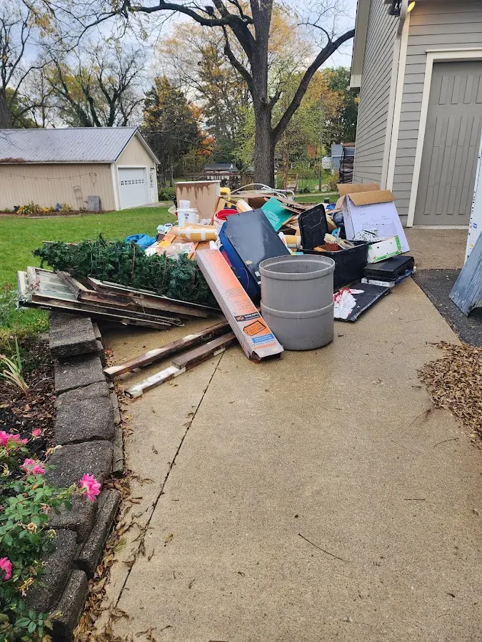 Dumpster being loaded with debris for 3 Yard Dumpster Rental in Seven Oaks